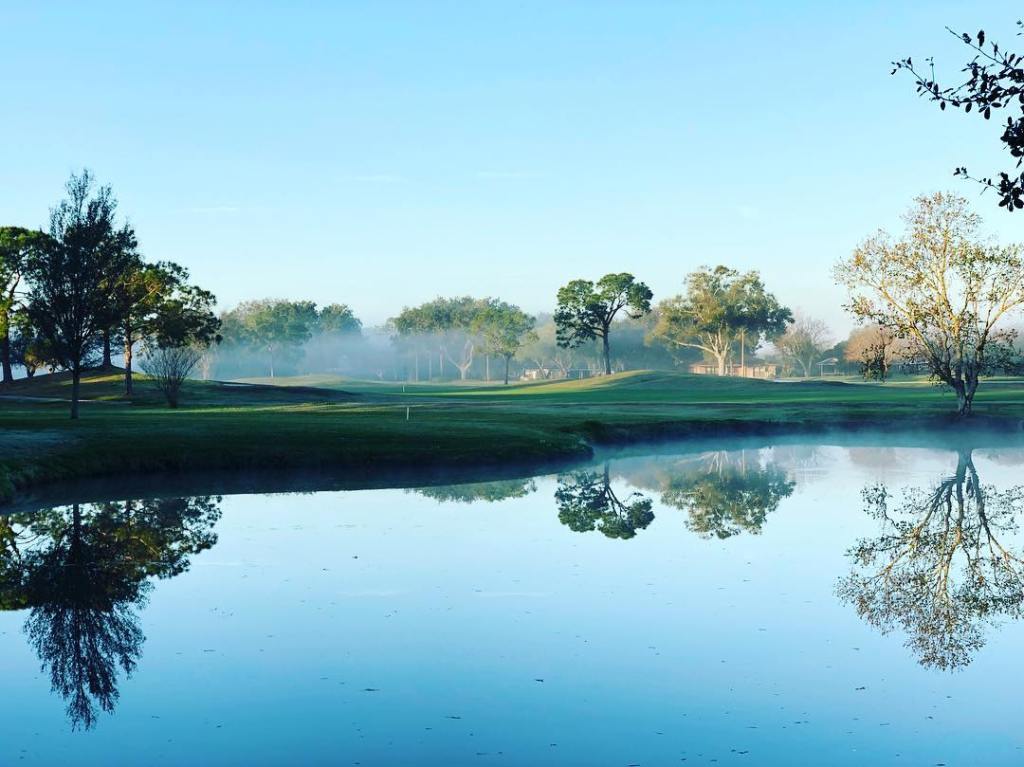 lake reflect the trees at the golf course