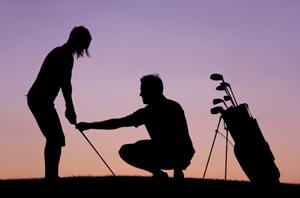Silhouette of golfers